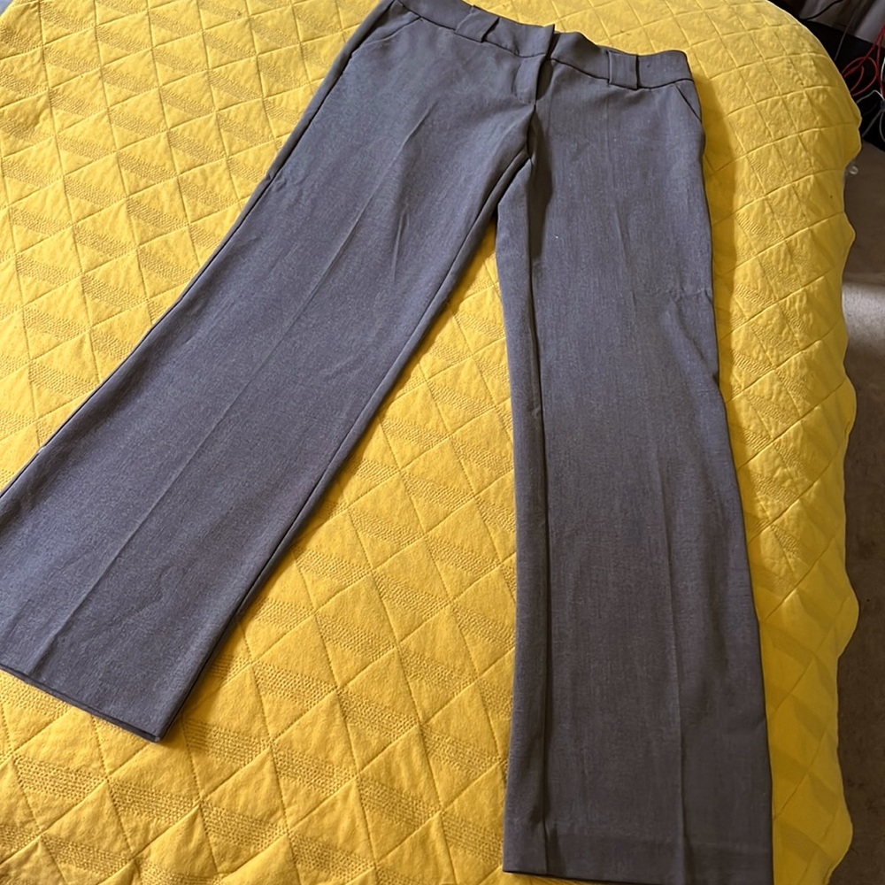 Grey Ny&co dress slacks, with glare bottoms, side pockets and wide belt loops.